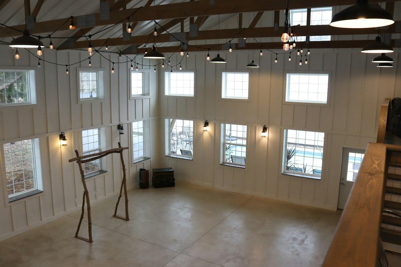 Rustic barn venue with arch and string lights